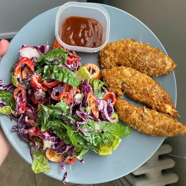 Chicken tenders breaded with low-calorie chips and served with a ranch salad