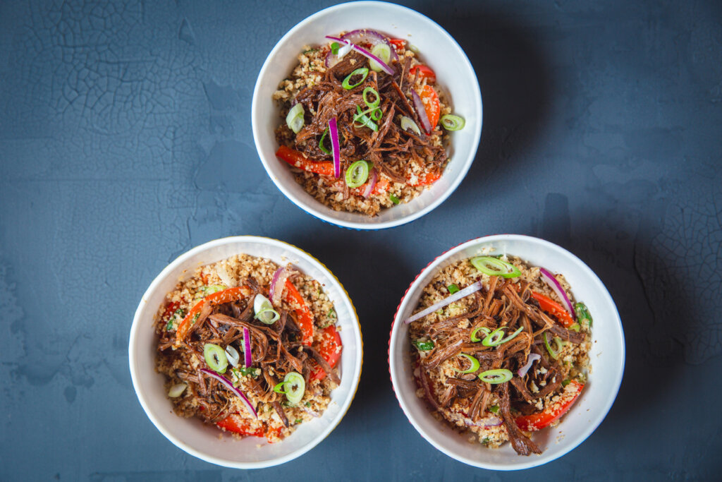Three bowls of barbecue beef and vegetable salad, a modern 21st-century appetizer presentation