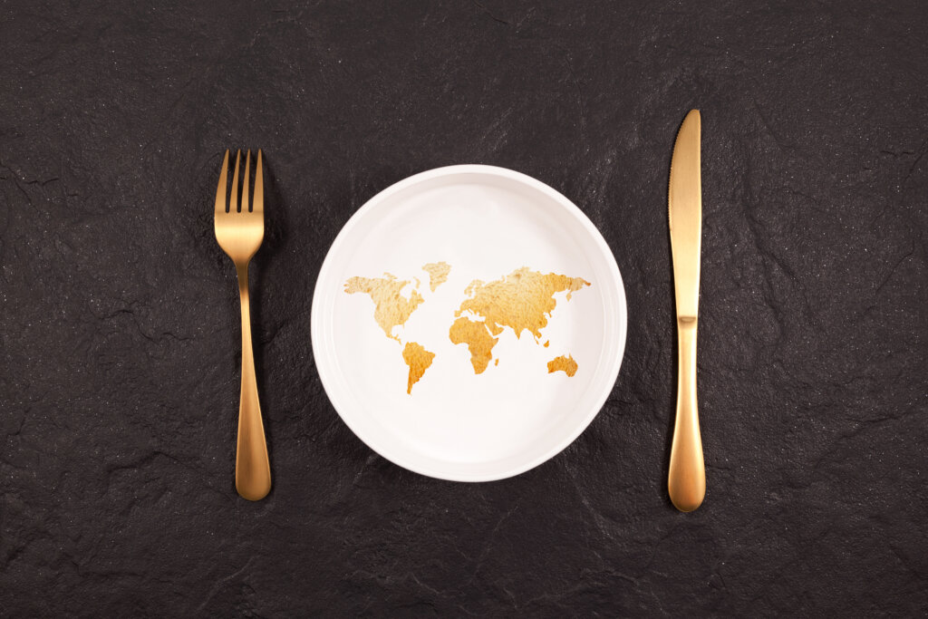 World map on a plate symbolizing how texture influences food choices across different global markets  