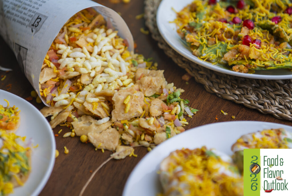 Colorful street style snacks dishes featuring layered textures, spices, and global flavors, highlighting how street food serves as a testing ground for bold food innovation and scalable menu trends. 