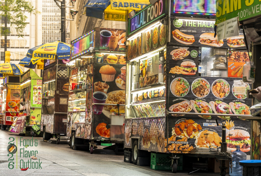 Colorful urban street food stalls with bright menu signs representing how street food trends inspire food innovation and mainstream menu development in North America.