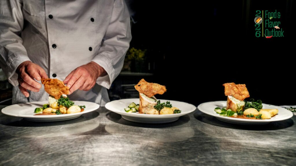 Chef plating dishes, representing how presentation enhances the overall dinning experience.