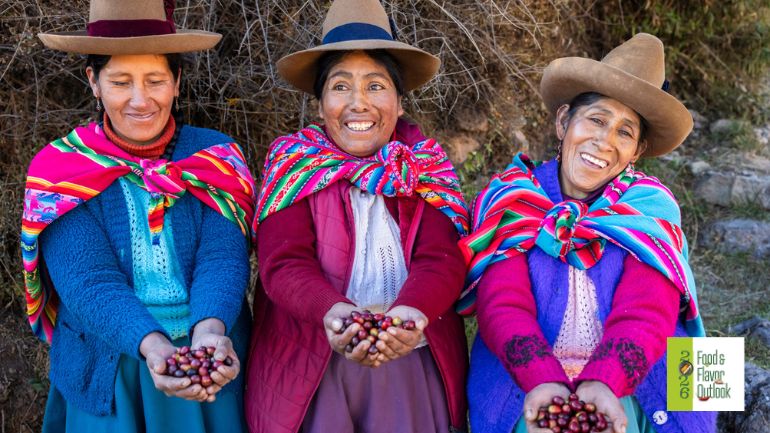 Three women in traditional clothing holding traditional ingredients, highlighting the connection between traditional foods, culture, and nutrition.